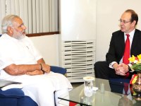 UK High Commissioner James Bevan speaks with Narendra Modi