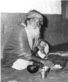 Yogi Ramsuratkumar eating his bhiksha.