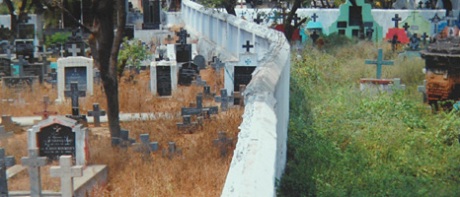 Caste-segregated Christian graveyard in Tamil Nadu: Dalits are buried on the left side of the wall, caste Christians on the right. 