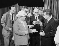 Soviet Premier Nikita Khrushchev and United States Vice President Richard Nixon debate the merits of communism versus capitalism in a model American kitchen at the American National Exhibition in Moscow in July 1959.