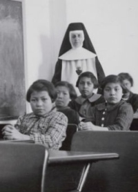Female students and a nun at Cross Lake Indian Residential School in Cross Lake, Manitoba.