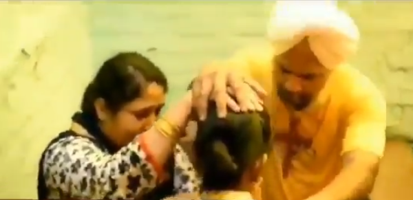 Missionary baptising Sikh convert to Christianity.