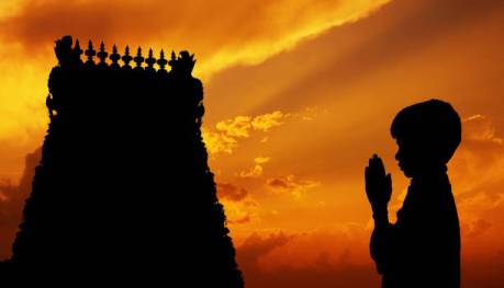 Hindu boy praying.